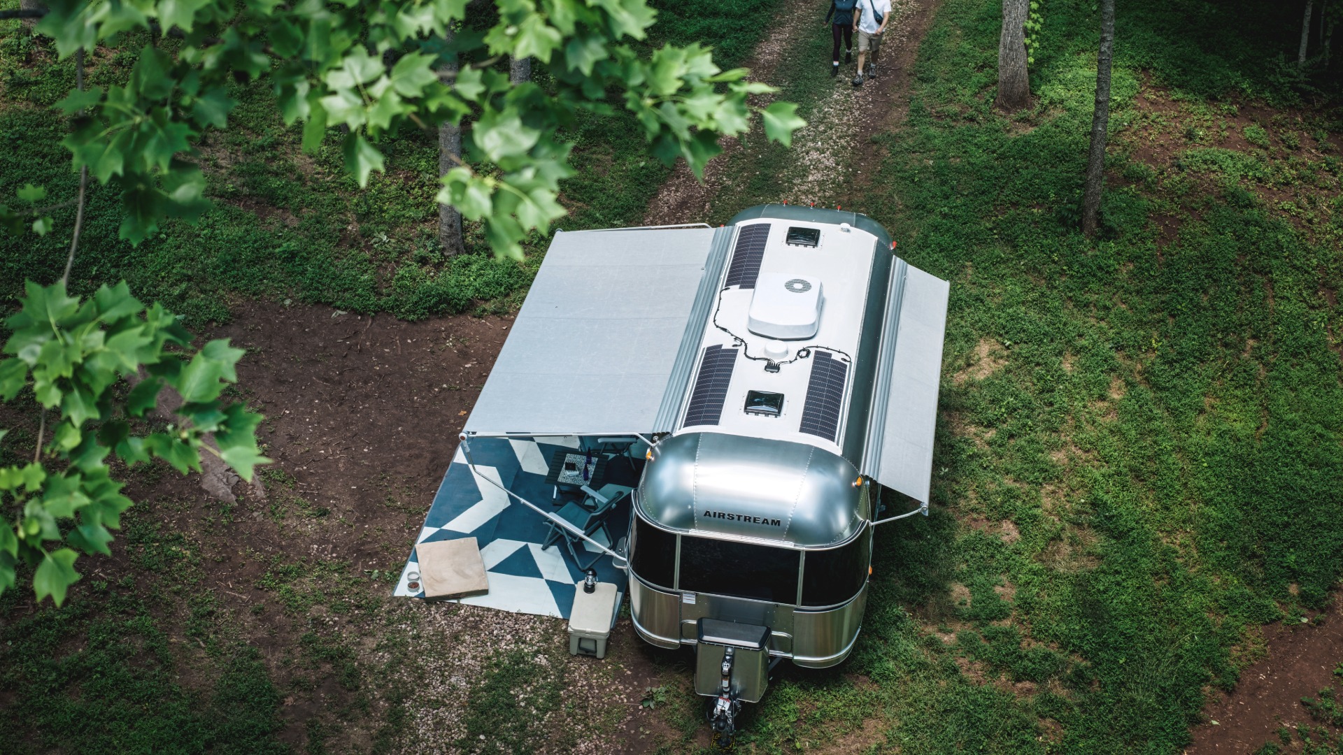 Airstream Flying Cloud viewed from above with rooftop solar panels and awnings